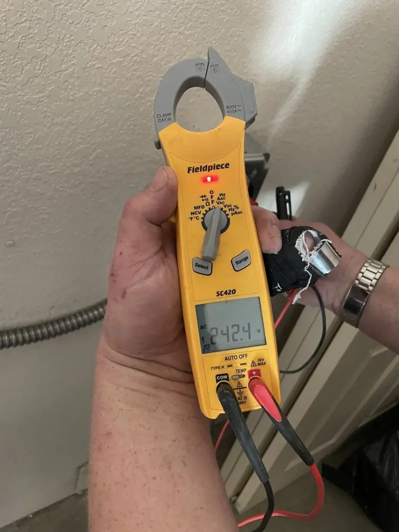 Voltage testing with clamp meter during Electrical Installation Services in Bellingham